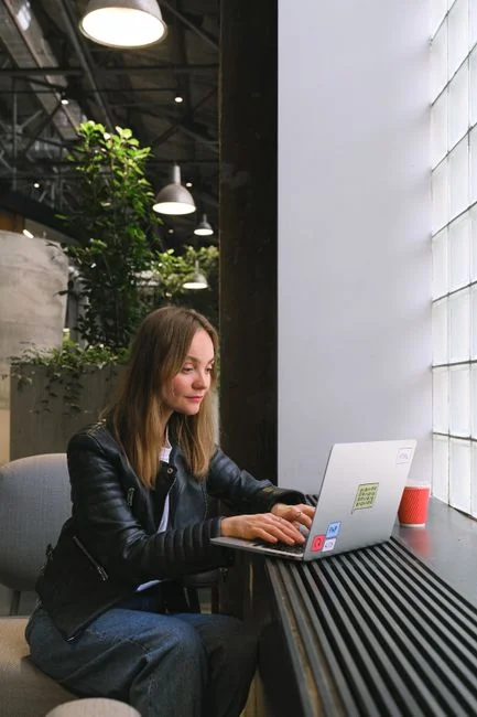 A modern workspace featuring a laptop, tablet, and smartphones, perfect for tech and freelance use.